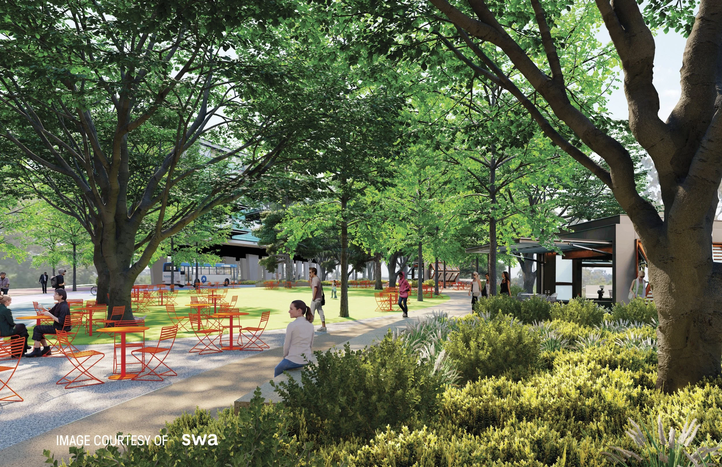 A shaded park promenade with seating and a transit stop where the freeway is today
